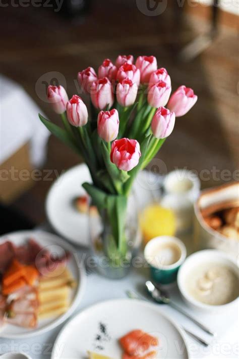 Summer breakfast with pink flowers 22738674 Stock Photo at Vecteezy