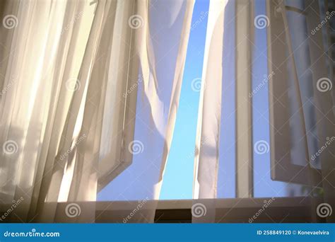 Wind Blows Through The Open Window In The Room White Curtain Veil From