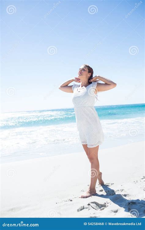 Pretty Brunette Relaxing Beside The Water Stock Photo Image Of Freedom Shore 54258468
