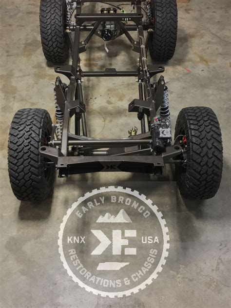 An Off Road Vehicle With Four Wheels On Display In A Warehouse Area Ready To Be Assembled