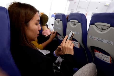 Premium Photo Young Woman Sitting In Airplane