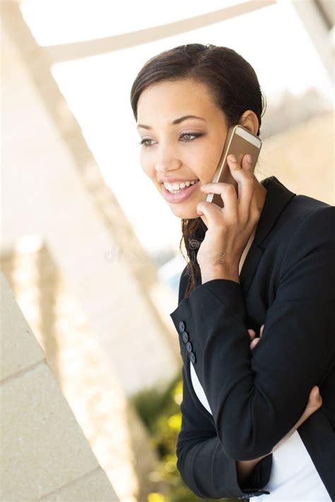 Business Woman Talking On Her Mobile Phone Outside An Office Bussiness