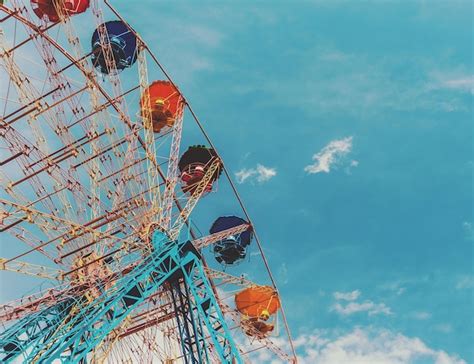 Premium Photo Entertainment Ferris Wheel Against The Blue Sky The