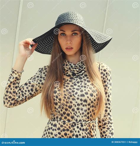 Portrait Of Beautiful Blonde Young Woman Wearing Summer Straw Hat