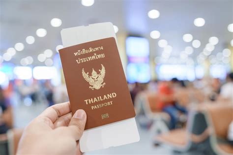 Premium Photo Hand Holding Thailand Passport And Boarding Pass Ticket