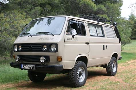 An Old Van Is Parked In The Grass