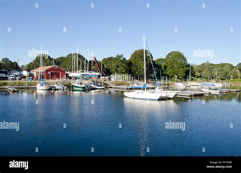 Picturesque Pocasset River in Pocasset, Cape Cod, Massachusetts, USA with marina and boats on a ...