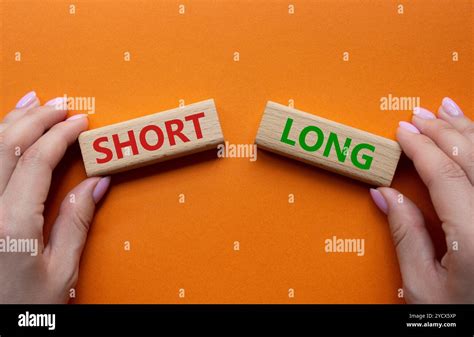 short  long symbol concept word short  long  wooden blocks