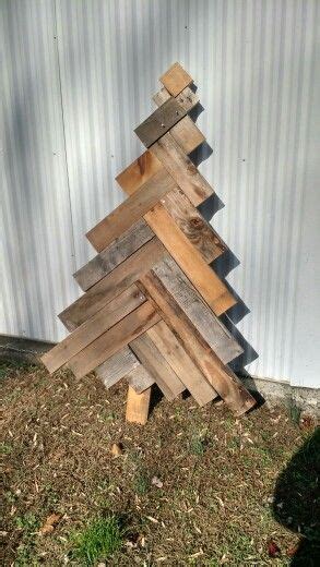 A Wooden Christmas Tree Made Out Of Wood Planks