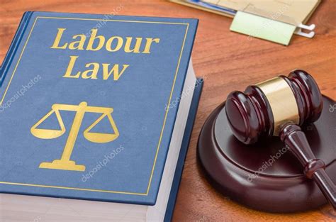 A law book with a gavel - Labour law — Stock Photo © Zerbor #69425525