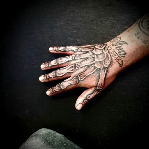 101 Latest Skeleton Hand Tattoos For 2024