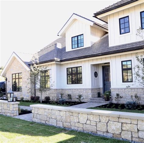 White and stone exterior by McEwan Custom Homes | House exterior, Modern farmhouse exterior ...