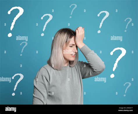 Amnesia Confused Woman And Question Marks On Light Blue Background