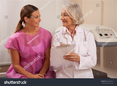 Happy Mature Woman Doctor Showing Bone Stock Photo 202249702 Shutterstock