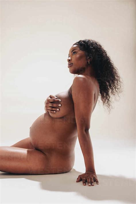 Confident African Woman Shows Her Naked Pregnant Body In A Studio