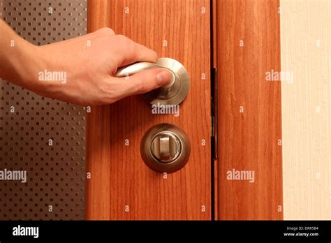 The Hand Opening A Door Stock Photo Alamy