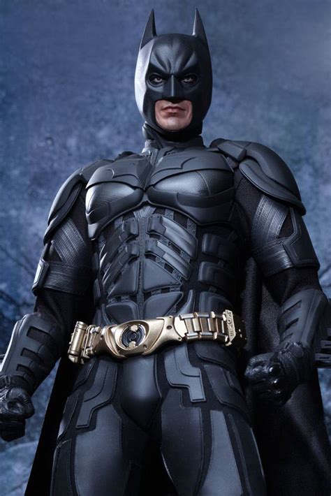 batman action figure from the dark knight movie, with gold accents and black leather armor