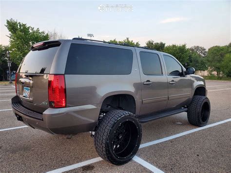 2011 Chevrolet Suburban with 24x12 -51 Vision Rocker and 325/45R24 Nitto Terra Grappler G2 and ...