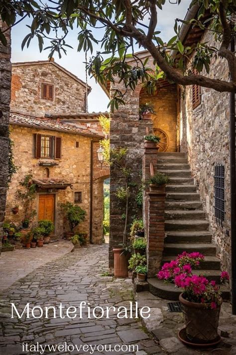 An Alley Way With Stone Buildings And Steps Leading Up To The Door