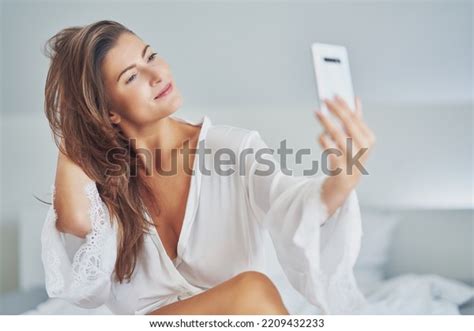 Brunette Sexy Girl On Bed Phone Stock Photo 2209432233 Shutterstock