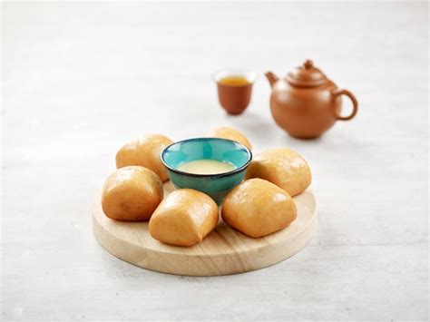 Premium Photo Golden Fried Mantou Or Chinese Fried Bun With Condensed