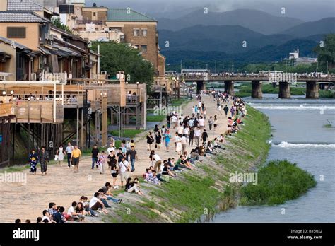 Summertime Along The Kamo River In Kyoto With Dining Terraces And