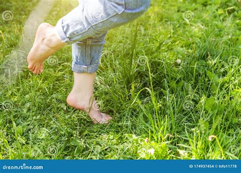 Two Beautiful Female Feet Walking On Grass In Sunny Summer Morning Light Step Barefoot Girl