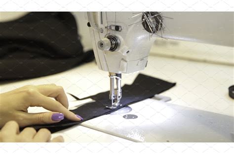 Sewing machine, seamstress sewing at | Graphics ~ Creative Market