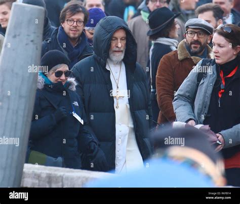 John Malkovich Wears An All White Pontiff Costume To Film A Scene For