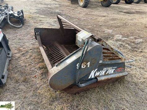 BOBCAT 72IN ROCK PICKER Michener Allen Auctioneering Ltd