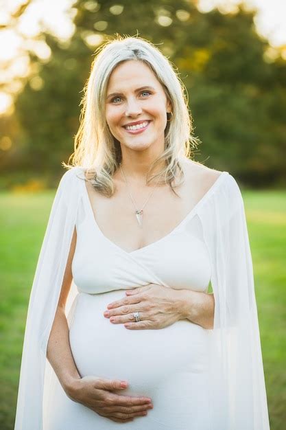 Premium Photo Portrait Of Pregnant Woman Standing Outdoors