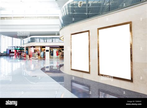 blank poster board wall in modern shopping mall Stock Photo - Alamy