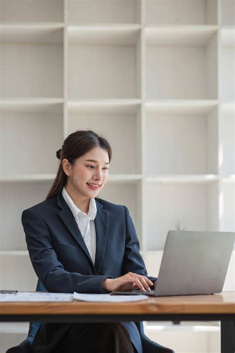 Asian Businesswoman Use Laptop Computer In Office The Internal Revenue