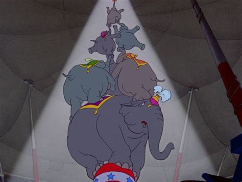 Dumbo - The circus director makes Dumbo the top of an elephant pyramid stunt, but Dumbo trips ...