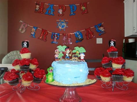 Jake Cake And Pirate Cupcakes Palm Trees From Hobby Lobby Figures From Disney Store Jake Cake