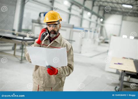 Engineer Looking At Plan In The Factory Stock Photo Image Of