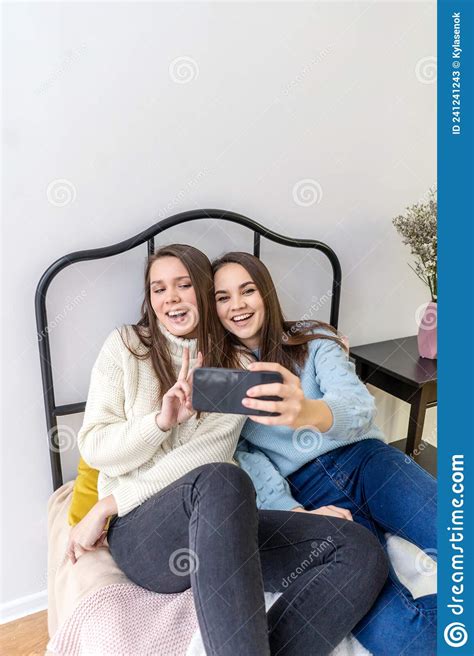 Pretty Young Women Friends In Sweaters Taking Selfie Stock Image