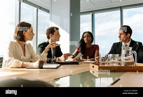 Female Executive Putting Her Ideas During Meeting In Conference Room