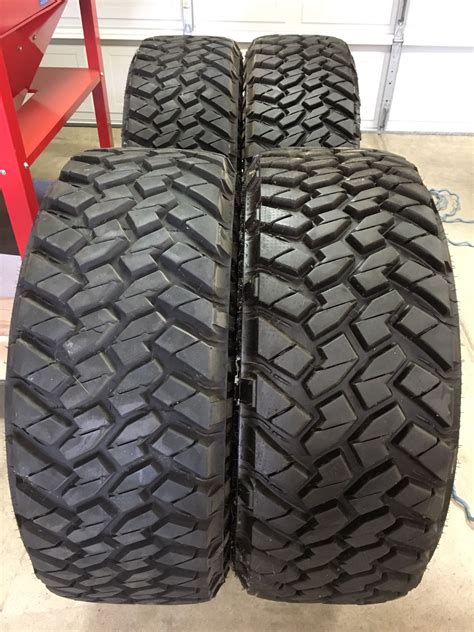 35x12 50R20 LT Nitto Trail Grappler M T Truck Tires And Black Rhino