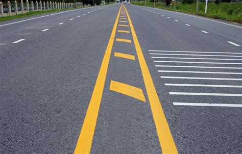 Premium Photo Yellow Lines On An Asphalt Road