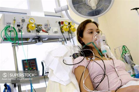 Female Patient Undergoing An Electrocardiography ECG Examination The