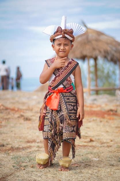 Premium Photo | Boys wearing traditional clothes from sabu island and ...