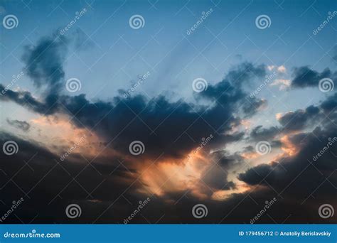 The Sky At Sunset Cumulus Clouds Lit By The Rays Of The Setting Sun