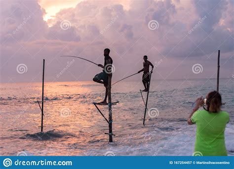 Silhouettes Of The Traditional Sri Lankan Stilt Fishermen On A Stormy