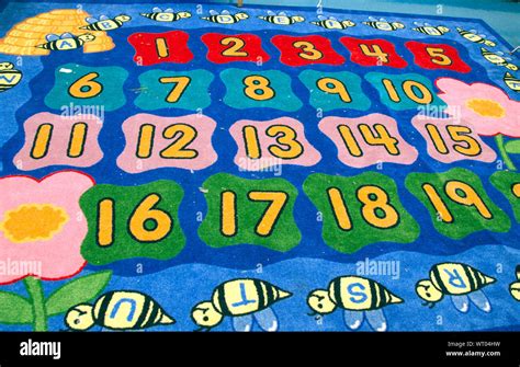 Colorful Carpet with Numbers & Letters in Kindergarten Classroom Stock ...