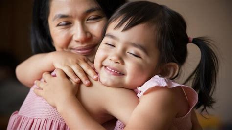 Premium Photo Close Up Of Girl Hugging Her Mother