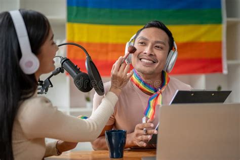A Joyful Asian Gay Man Radio Host Is Being Made Up By A Female Guest In