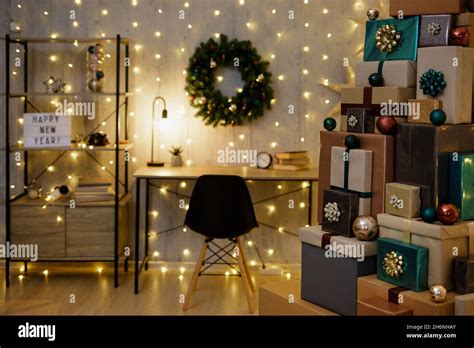 decorated home office with heap of gifts, led lights and christmas ...