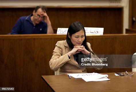 Investor Lillian Zhang Contemplates A Bid During A Tax Lien Auction