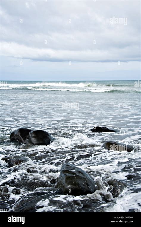 The Black Volcanic Beach And Rocky Shore On The South Taranaki Bight By